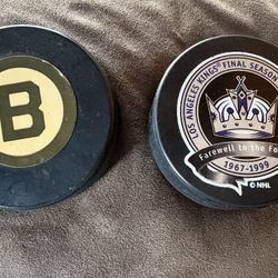 2 Hockey Pucks 1 Boston Bruins From The 90’s And One Kings From From 1999 Last Year Commemorating The Last Days At The Fabulous Forum 