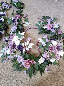 2 Artificial Flower Garland wreaths for table decor

Condition is used twice
$120 for longest wreath
$110 for shorter

Measurement of each arrangement