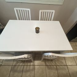 Extendable white table, chairs included for free