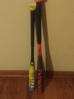 2 used baseball bats and 9 baseball's