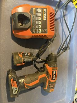 drill with two batteries and charger