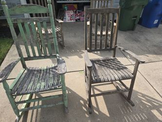 Pair of vintage rustic wooden rocking chairs