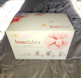 Bowdabra bow maker tool used for crafting ribbons into bows.