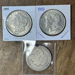 Three Morgan Silver Dollars. Group 26.