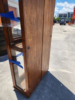 Glass wooden cabinet.
