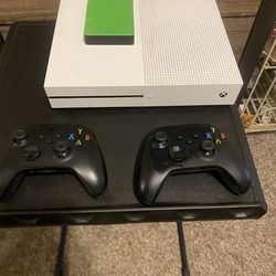 Xbox One S console with controllers and seagate adapter