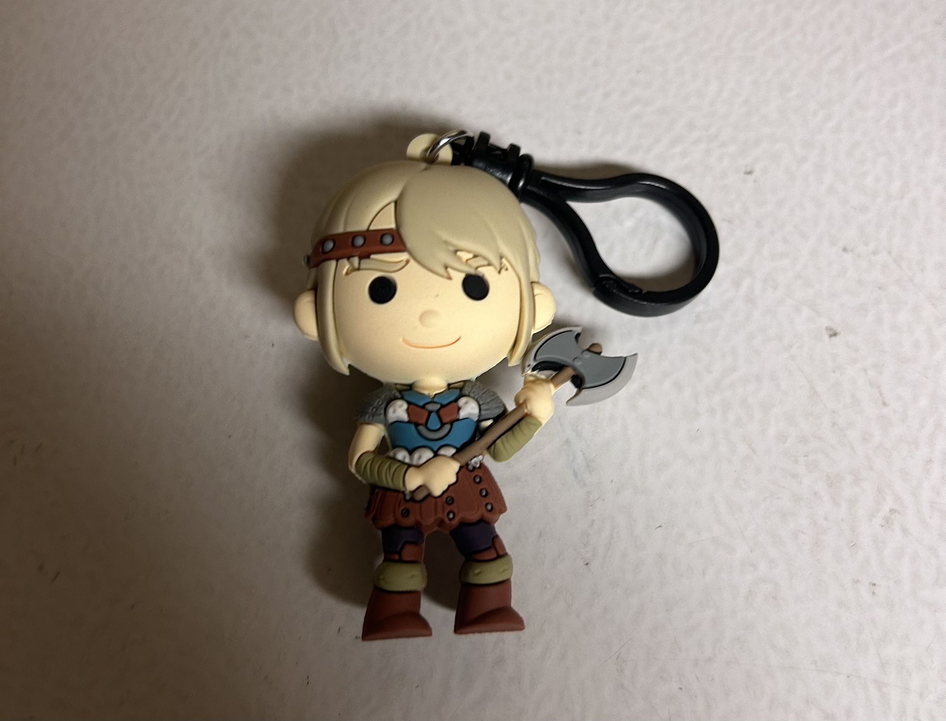 Astrid clip-on keychain or mini-figure from the How to Train Your Dragon series.