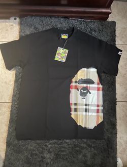 BAPE x Burberry black t-shirt with white, red, and beige checkered pattern on the front