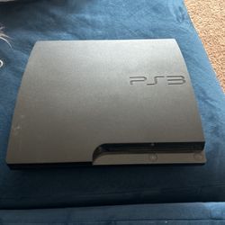 PS3 W/ Two Remotes And Games