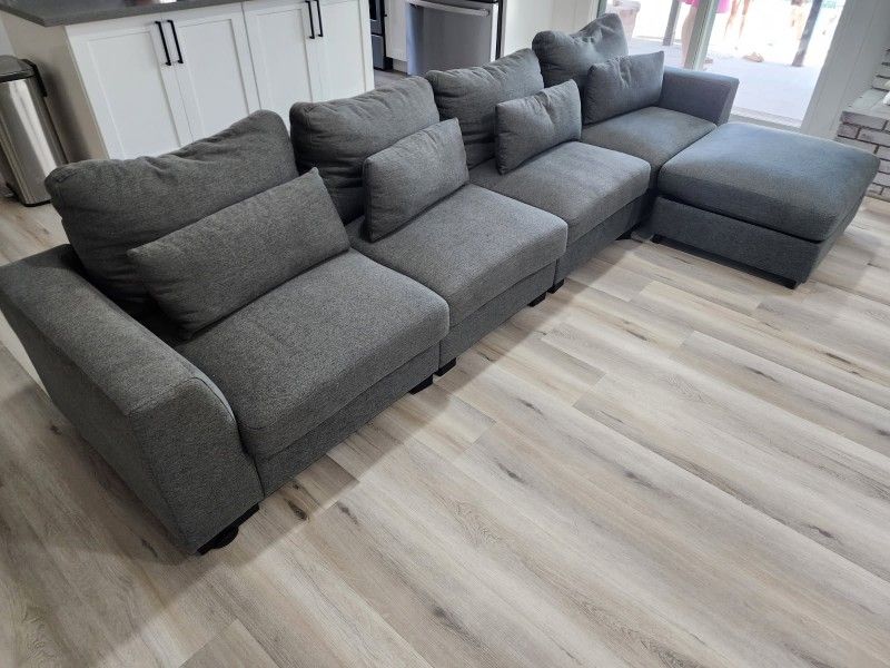 L Shaped Grey Couch. Only 4.months old. Original.price $600