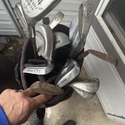 BAG OF USED GOLF CLUBS