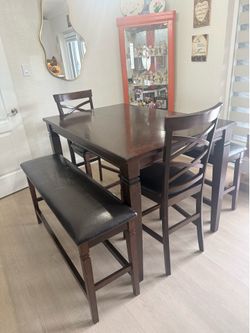 Dining table with chairs and benches