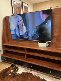 Rolling mounted TV stand