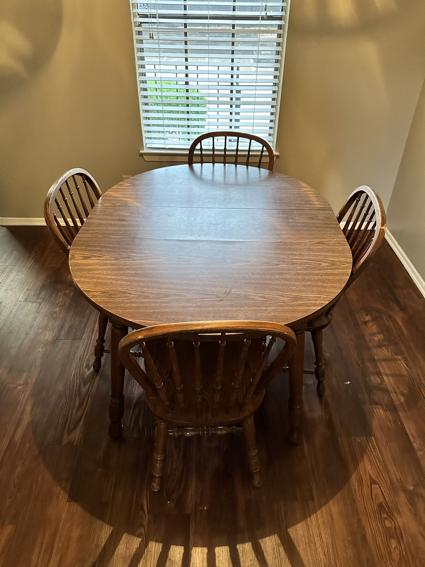 FREE BROWN WOOD TABLE SEATS 4
