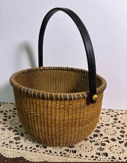 Woven Rattan Basket with Dark Wood Handle