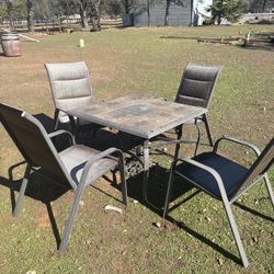 Metal And Tile Patio Table And Four Chairs