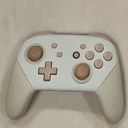 Pink and white Nintendo switch pro controller