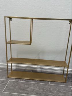 Gold wall shelf