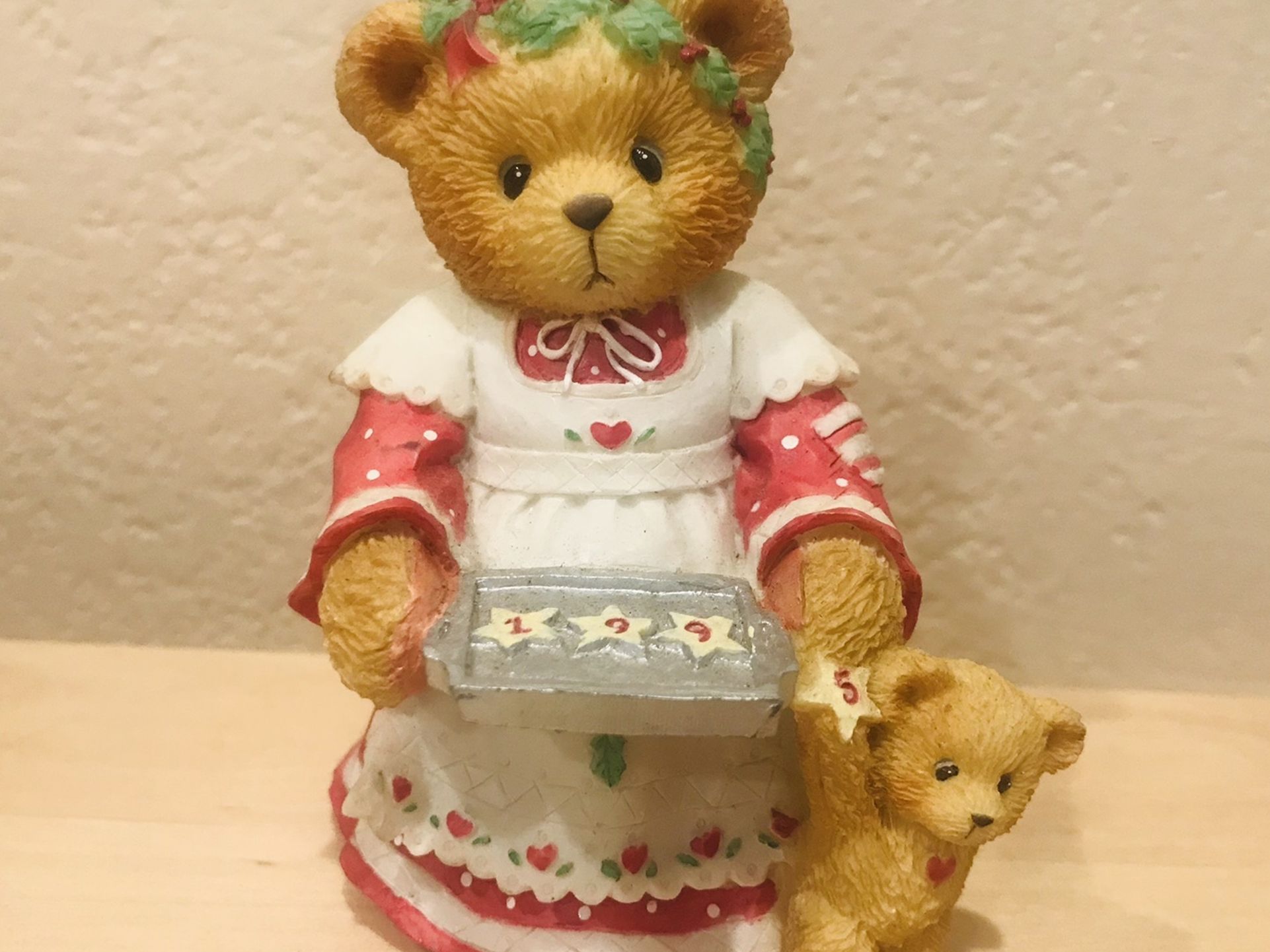 cherished teddies"Amanda"girl holding cookie tray marked 1995.bear next to her.