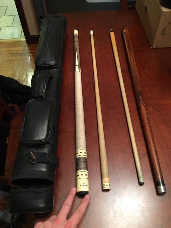 Mucci 9712 pool cue with red dot shaft. Mint. Unmodified shaft. Also includes a Dufferin break cue and dual cue case.
