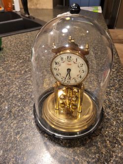 Kundo gold analogue clock in domed case 
Unknown working condition of clock