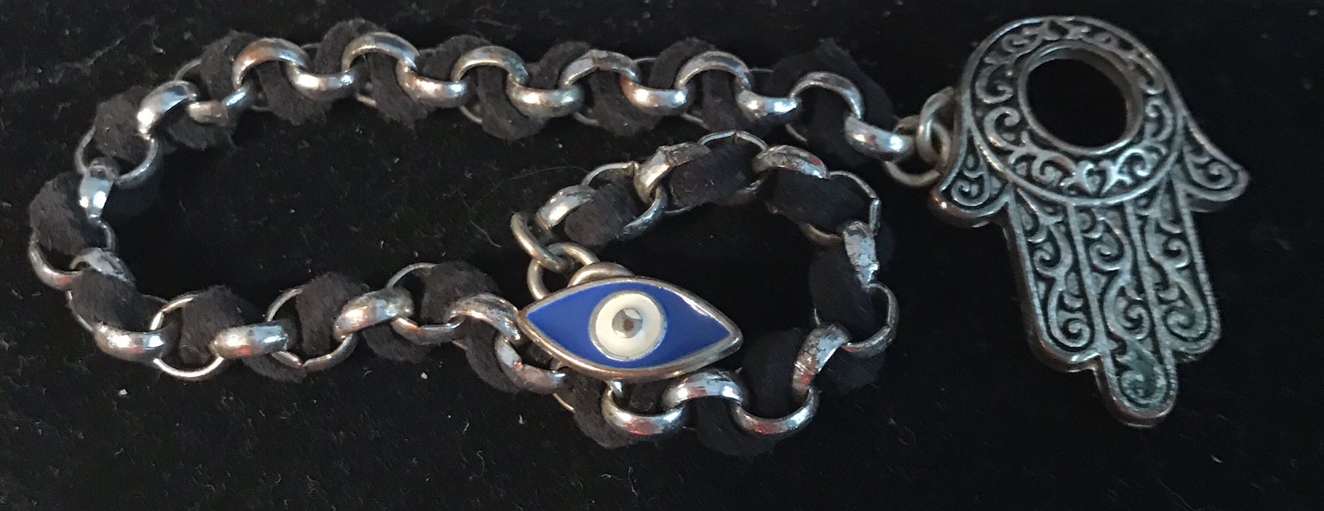 Eye and hand silver and black suede bracelet