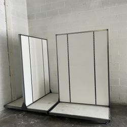 two white grocery store retail furniture shelf equipment movers with wheels 