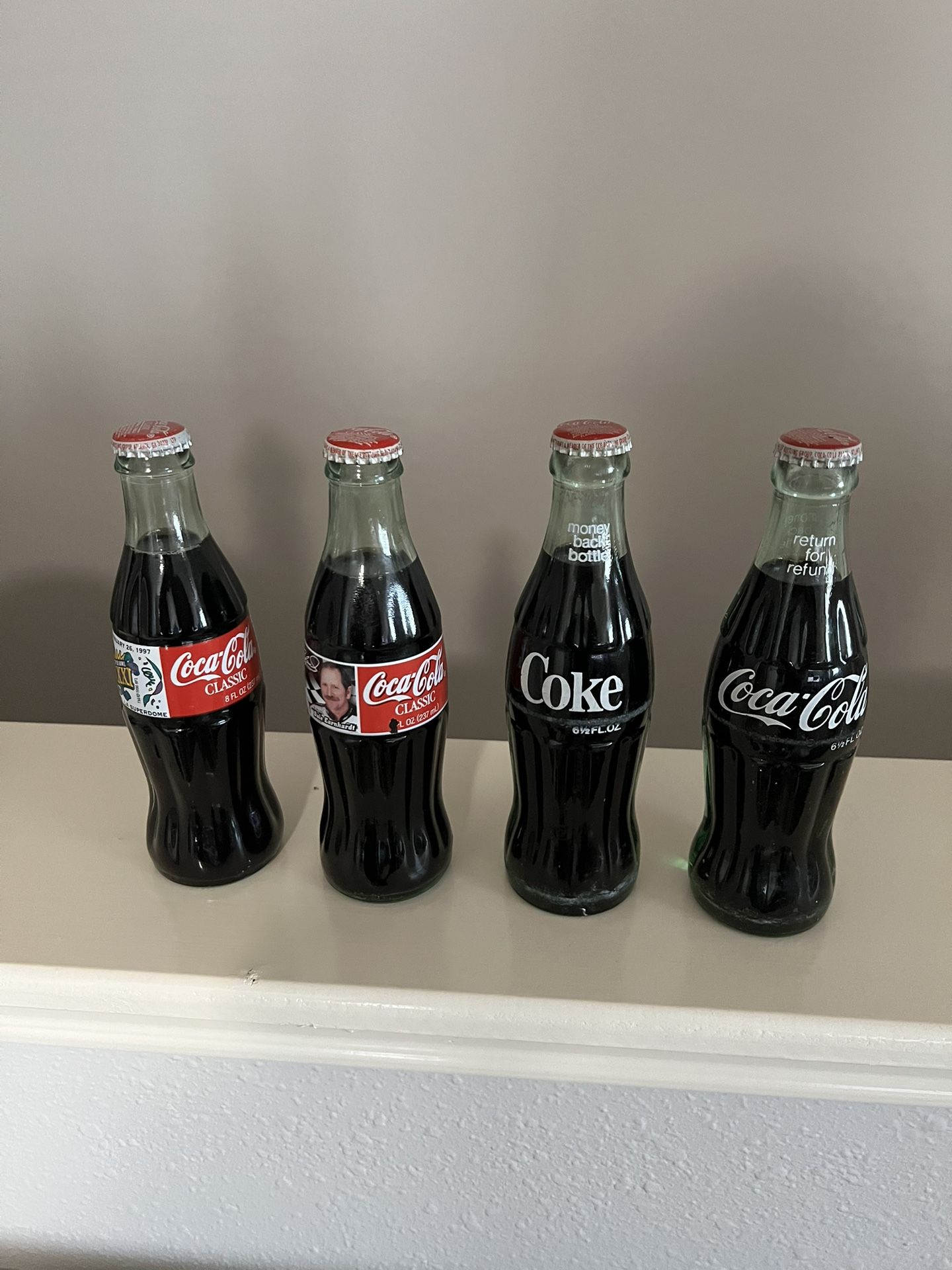 4 Coca Cola Bottles