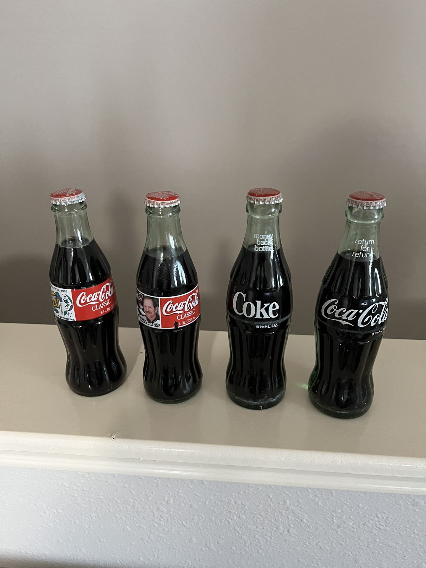 4  Coca Cola Bottles 