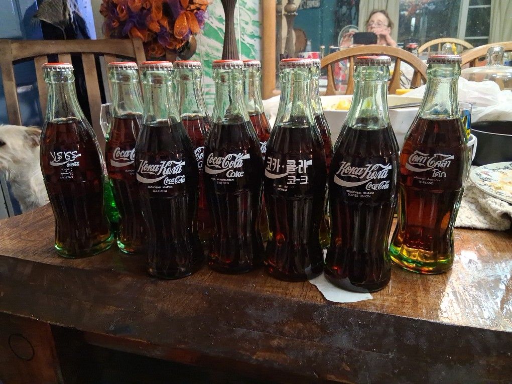 11 Collectors Bottles Of Coca Cola