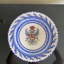 Vintage Spanish pottery wall plate featuring the coat of arms of Toledo. New. 11.25” diameter