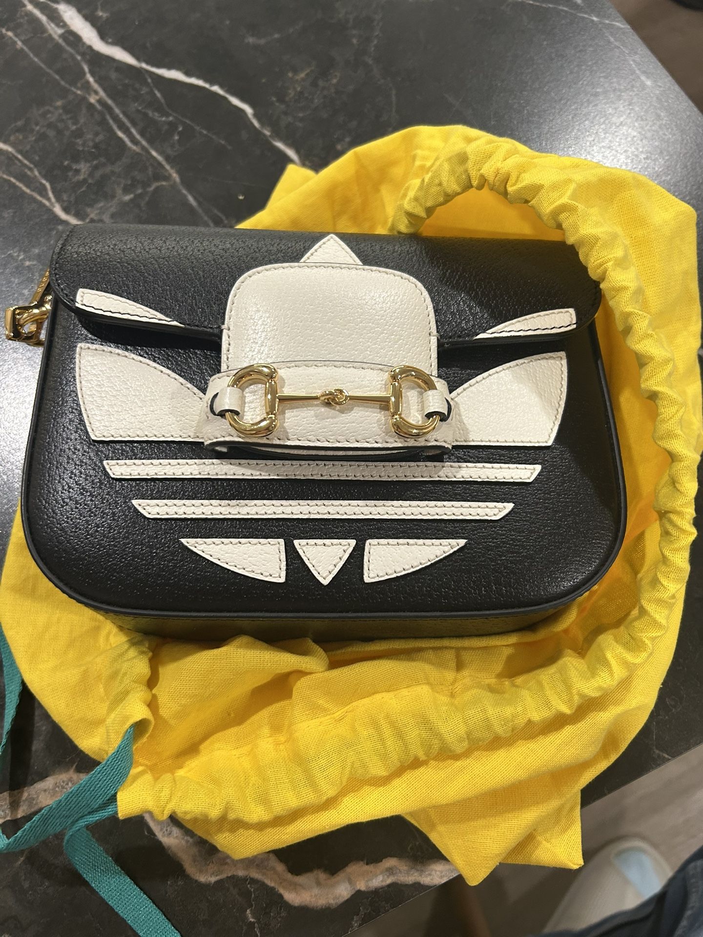 Gucci bag and adidas