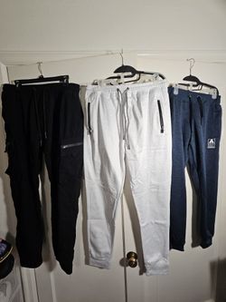 Black tech pants(2xl) along with white and blue sweats(Large)
