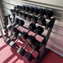 New pair of 5,10,15,20,25,35,45,55lb rubber dumbbells + rack. All new in box $495