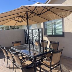 Outdoor Patio Dining Table With An Umbrella