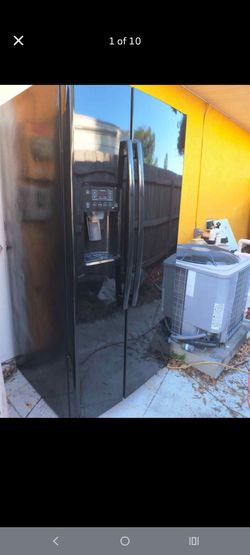 GE Refrigerator color black 33 in wide 70 in high and 31 in deep
