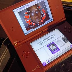 NINTENDO DSI XL HAND HELD GAMING SYSTEM BRONZE UTL-001  WITH GAME GRAND THEFT