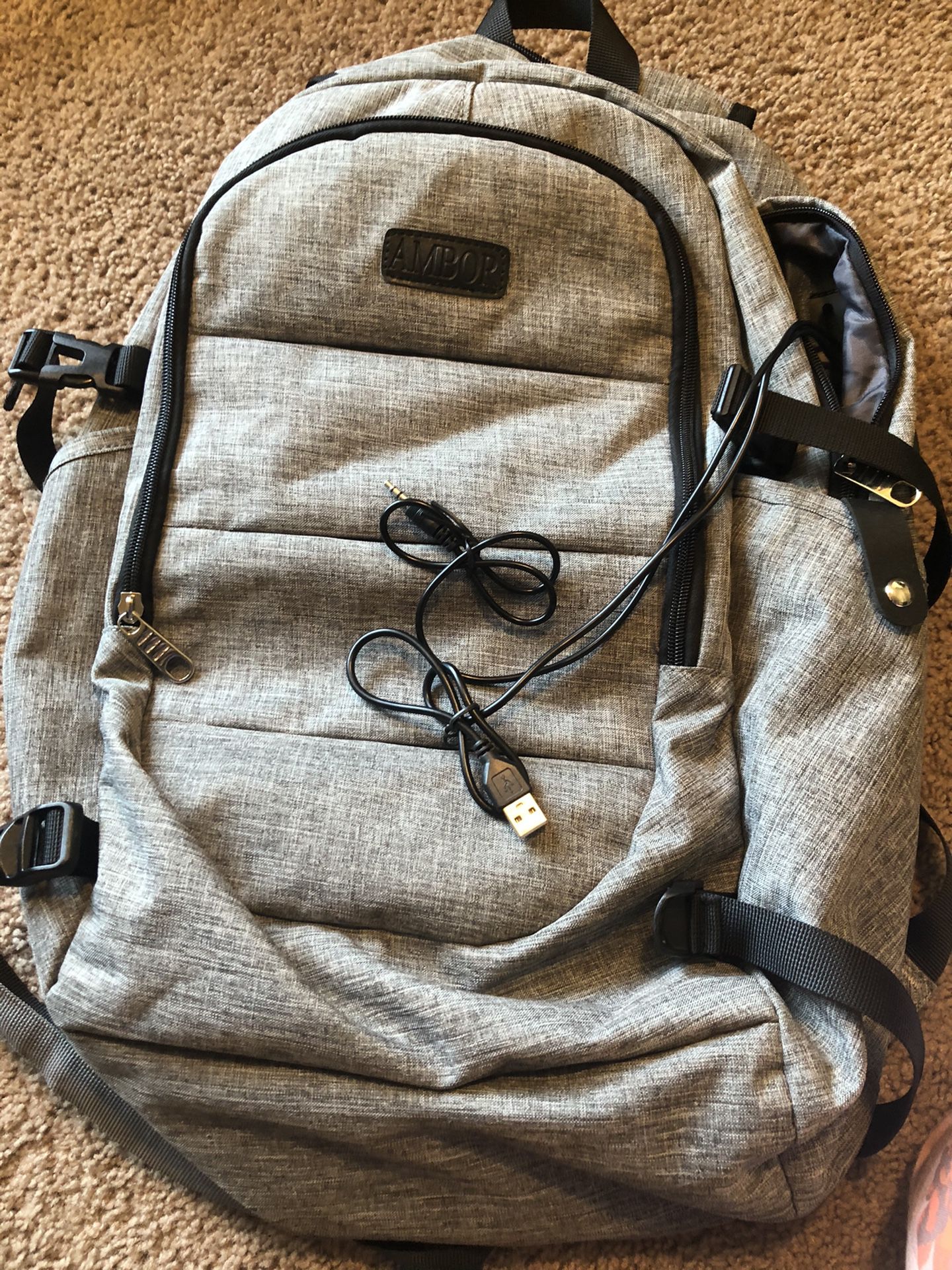 Backpack with external USB port, headphone jack