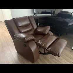 Brown faux leather armchair with rocking and reclining feature
