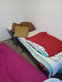 Cot With Blankets And Pillows