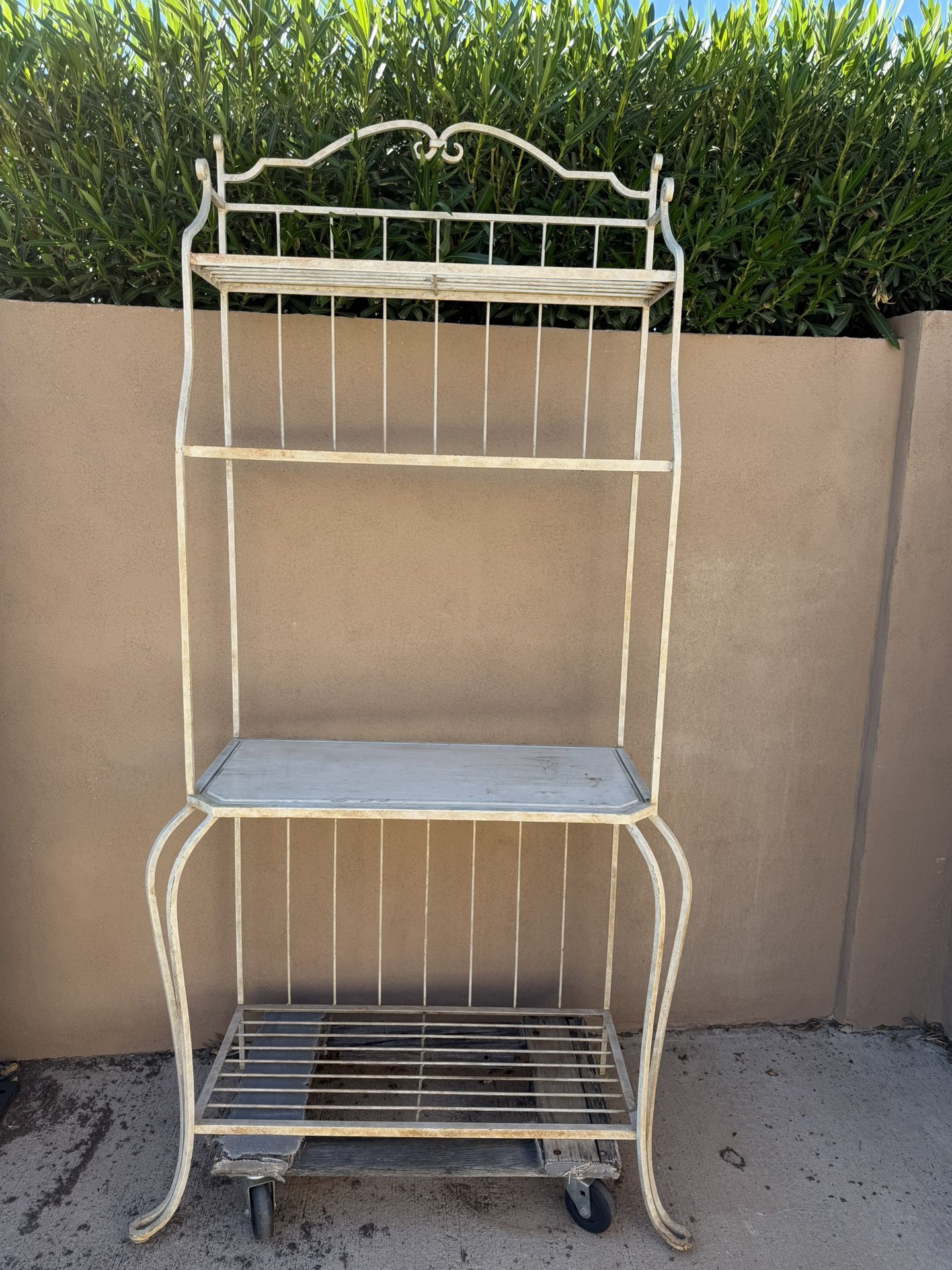 Vintage metal rolling shelf with three tiers. Metal pot holder