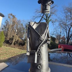 SCULPTED METAL WINE BOTTLE HOLDER