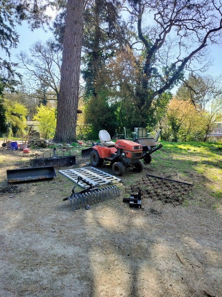 Two Ariens S14H Garden Tractors, Implements And Loading Ramps