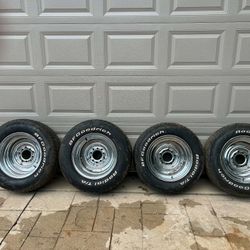 FOUR 15” CHROME REVERSE WHEELS WITH UNIVERSAL LUG PATTERNS AND RADIAL TIRES
