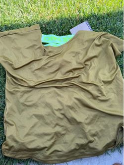 Loose fitting women’s Nike dry fit olive color shirt