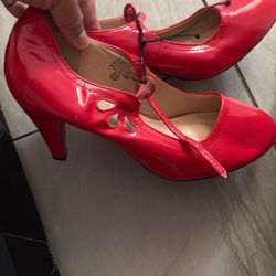 Red heel pumps