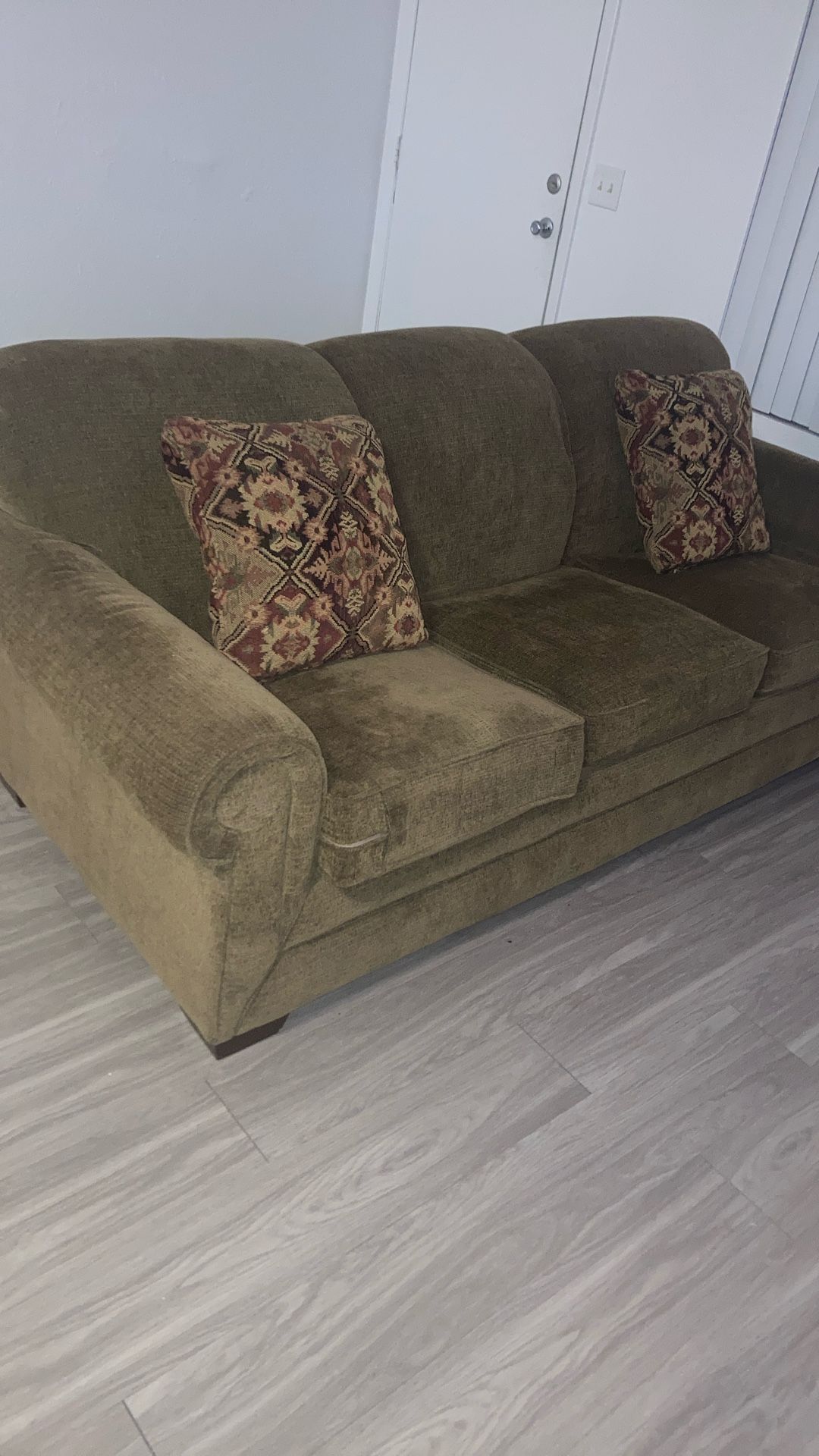 Brown couch turns into queen bed