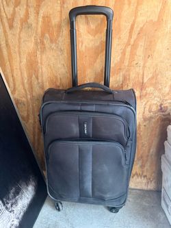 Carey on luggage