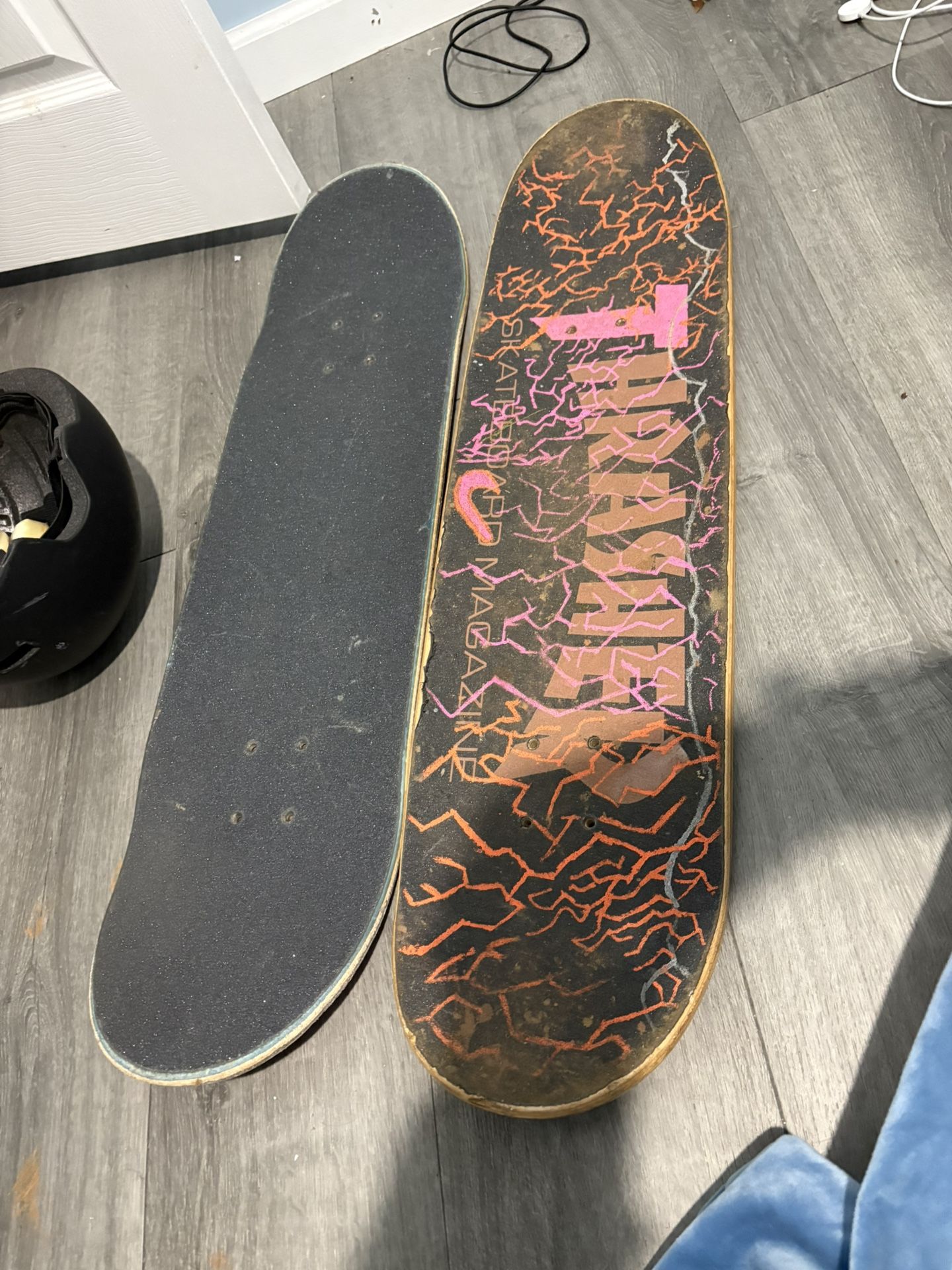 Two Boards A Helmet And Two Sets Of Wheels With One Set Of Bearings
