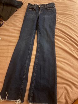 Women’s mid-rise bootcut jeans, size 3/small.